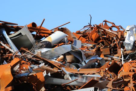 many rusty ferrous scrap in a controlled landfill of a foundry